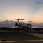 HALO aircraft against the sunset.